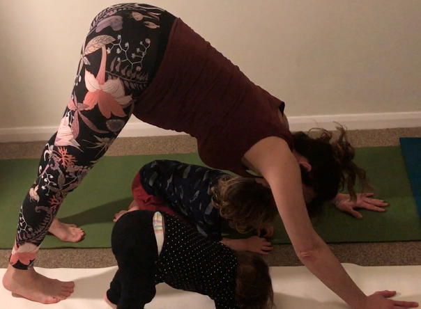 Kat Frost of Yoga2shape does downward dog pose with two toddlers in a children's yoga class (YogaShapes).